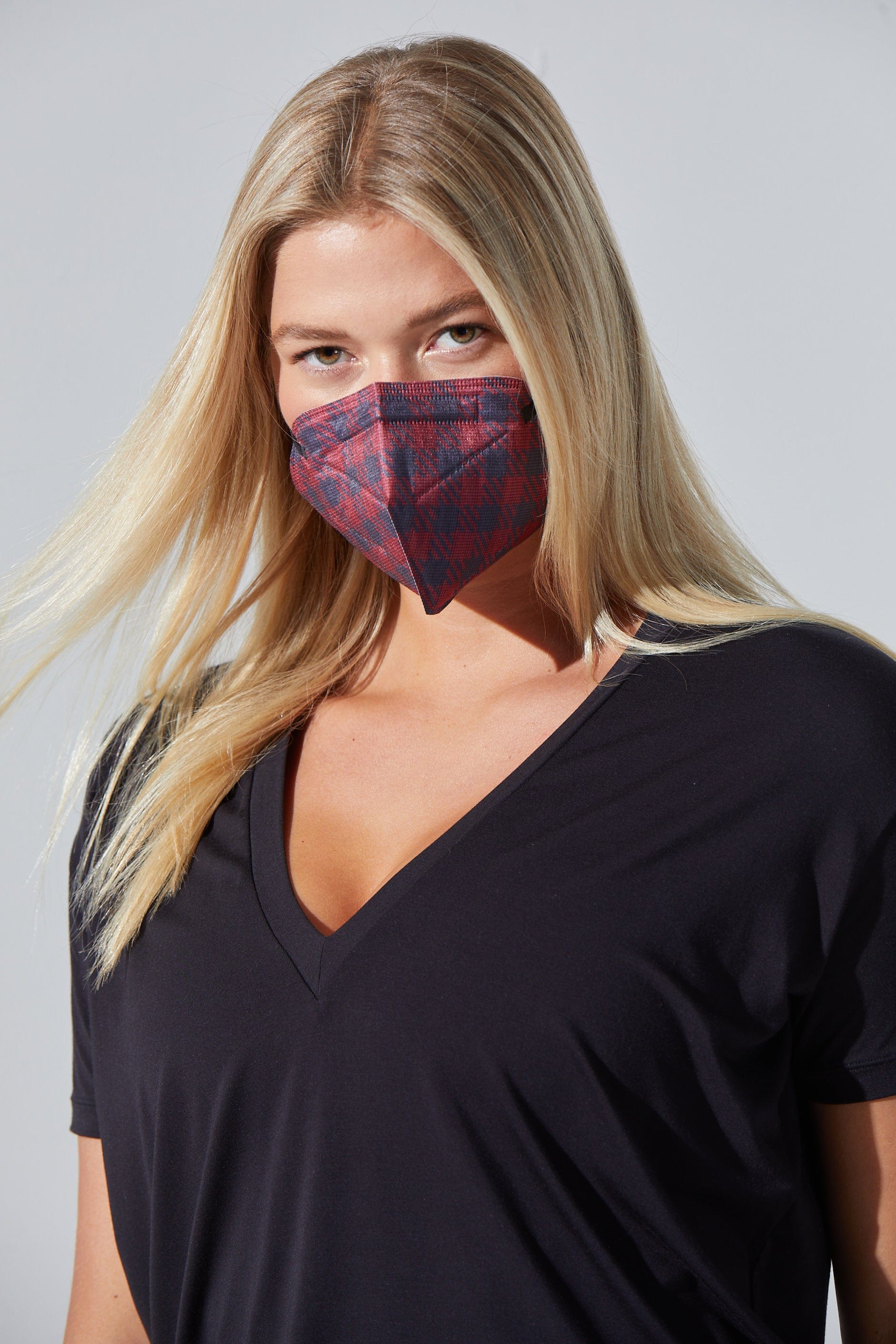 Woman wearing stylish Red & Black Plaid KN95 face mask, with high quality breathable fabric. 